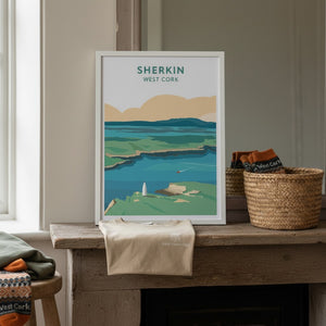 West Cork Folk Sherkin Island A4 print featuring a colourful landscape with sea, hills, and a sailboat. Framed in white.